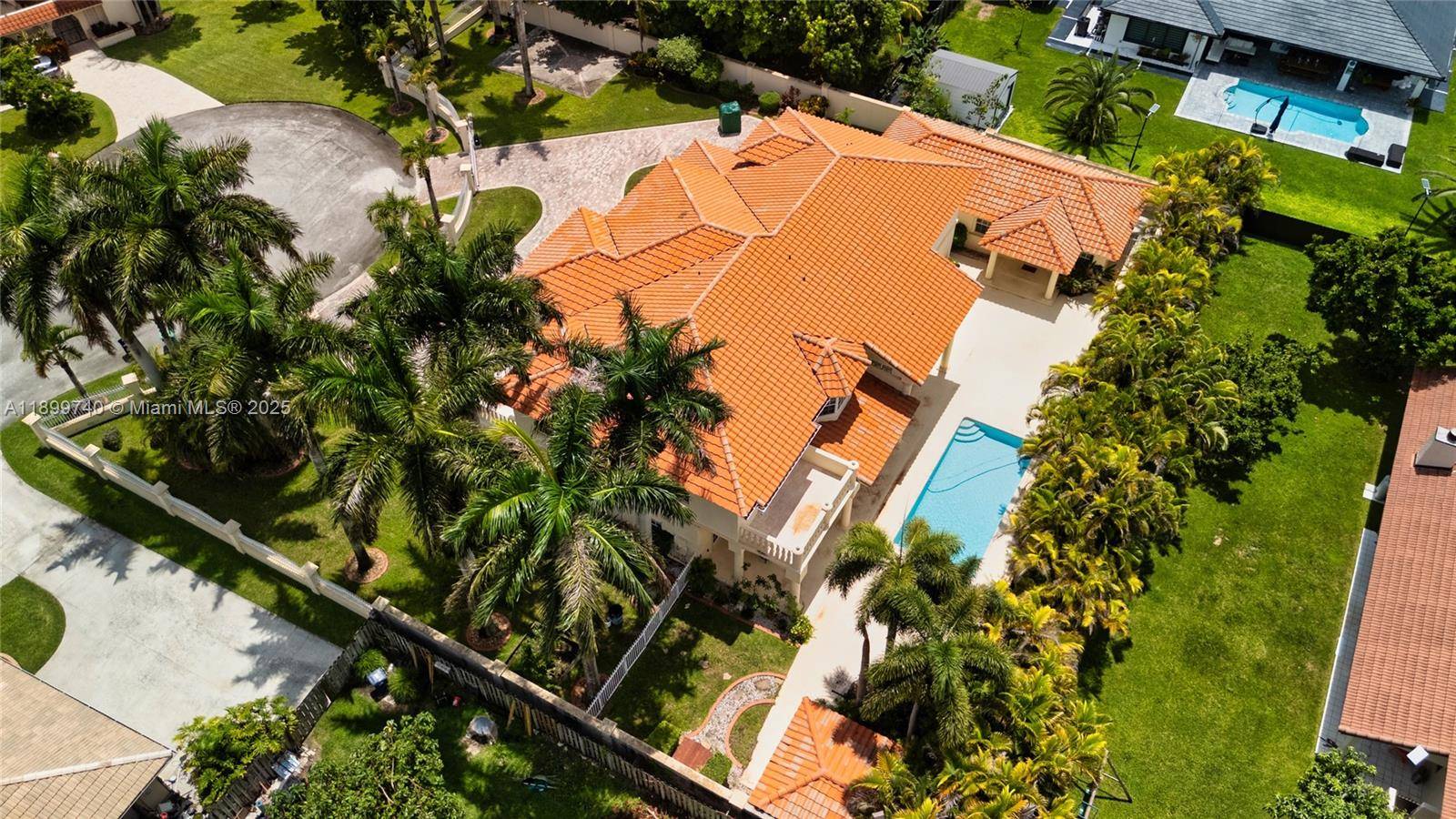 Privately positioned at the end of a cul de sac, this custom built estate invites you to live expansively with over 6, 000 SF between the main home and private ...