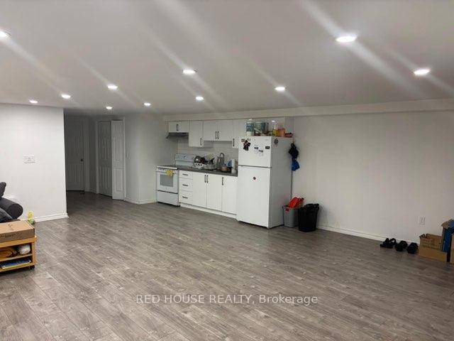 Spacious basement apartment in a mixed use building, featuring two generously sized bedrooms, a modern four piece bathroom, convenient ensuite laundry, and a large open concept kitchen living dining area ...