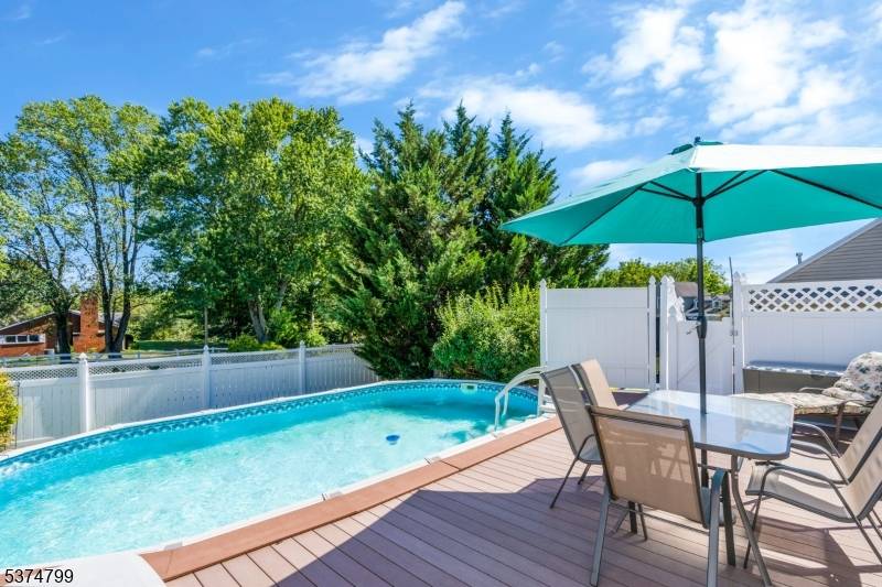 Welcome to this beautiful 4 bedroom Cape Cod situated on an oversized lot, offering both charm and functionality.