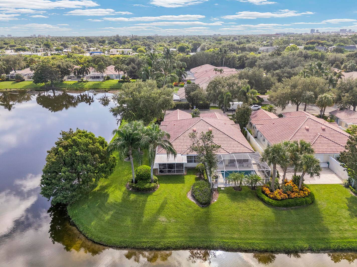 This is a MUST SEE ! Rarely available corner villa in The Isles, perfectly positioned on the community's largest lake with stunning water views on two sides.