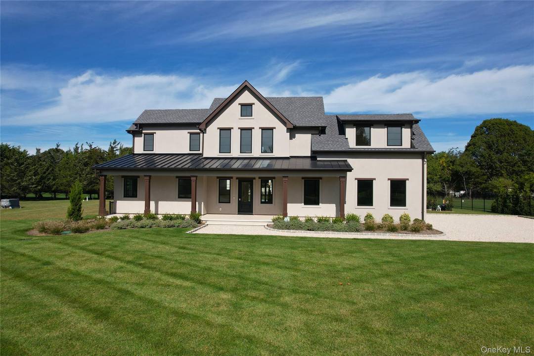 Discover the epitome of North Fork living at 2045 Willow Dr, a stunning contemporary farmhouse nestled in one of East Marion's most coveted high end neighborhoods.