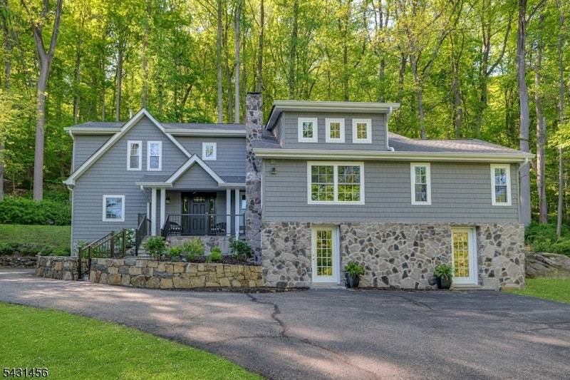 Nestled in the historic hills of the sought after Brookside section of Mendham Township, this exquisite fully renovated country style home seamlessly blends timeless charm with modern luxury.