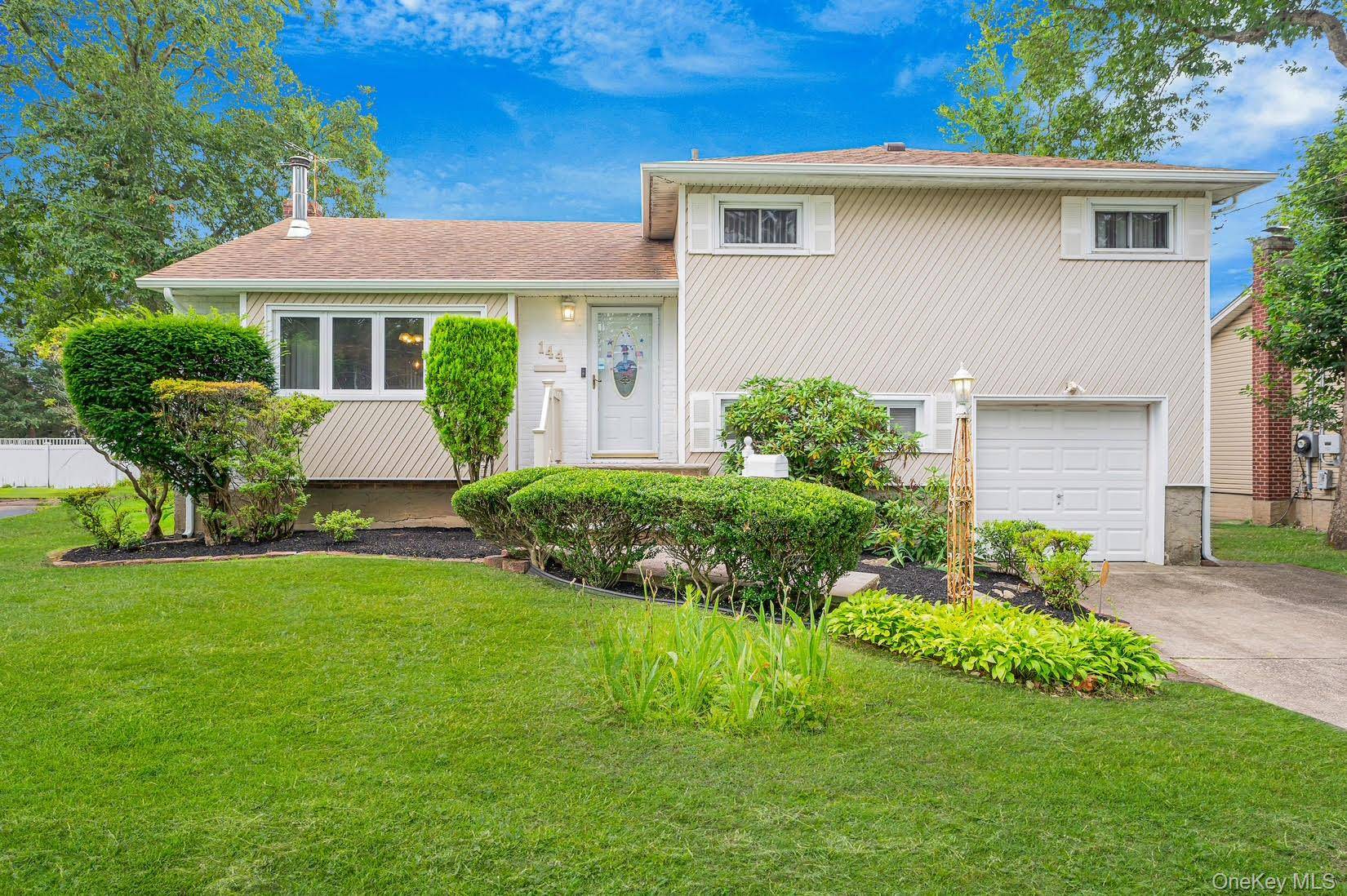 Welcome to this well maintained split level home featuring 4 spacious bedrooms and 2 full baths, perfect for families or those who love to entertain.