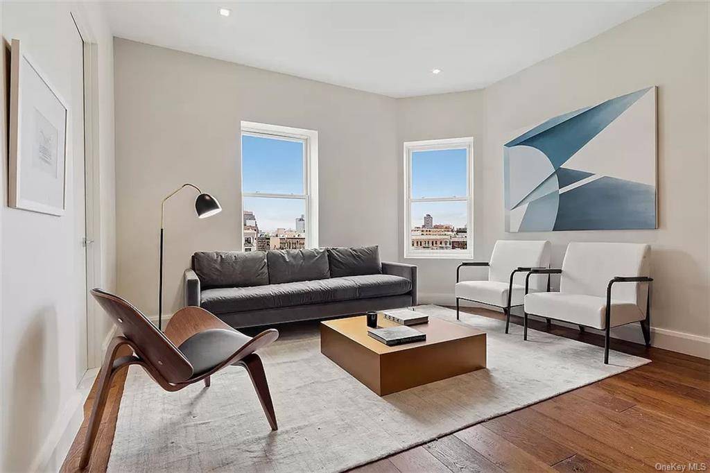Newly constructed within an original ornate Beaux Arts facade, this three bedroom two full bath residence has been designed with a minimalist aesthetic, high performance features, and the finest craftsmanship.