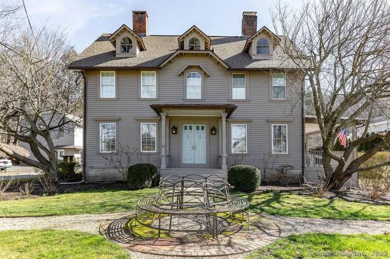 Located on Main Street South in the heart of Woodbury, in the Litchfield Hills, this versatile property offers the perfect opportunity for a retail antique showroom or traditional living.