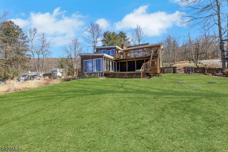 Rare opportunity to own a true lakefront property on Upper Greenwood Lake with direct water access.