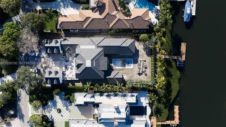 A nearly complete brand new waterfront estate home, on one of the most exclusive private island streets in all of Admirals Cove.