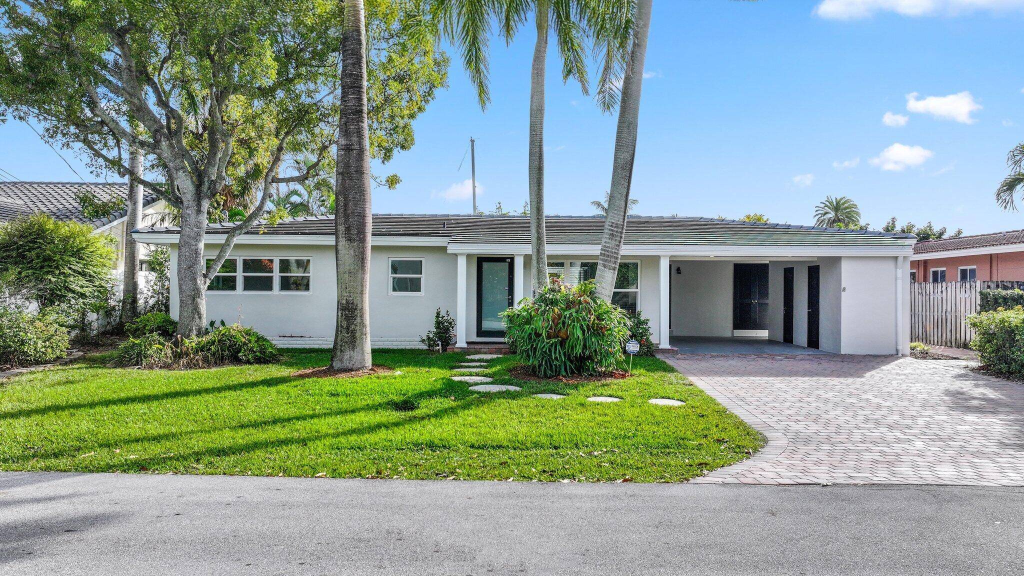 Discover your own boater's paradise with this beautifully remodeled residence offering 75 feet of water frontage and direct access to the Intracoastal Waterway no fixed bridges for seamless navigation.