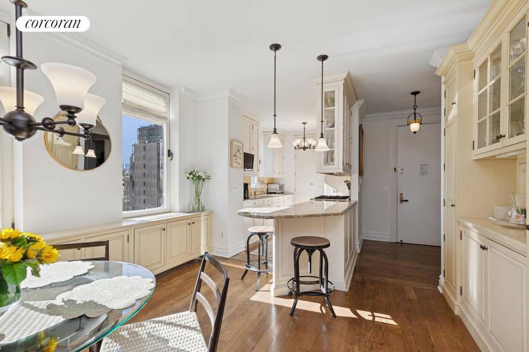 Enjoy your sun flooded, mint, renovated 2 bedroom 2 bath 1457 square foot home with soaring 9' ceiling and handsome new wide oak strip floors.