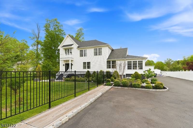 Welcome to this exceptional 5 bedroom, 4 full bath custom home situated on an expansive property in Somerset, NJ.