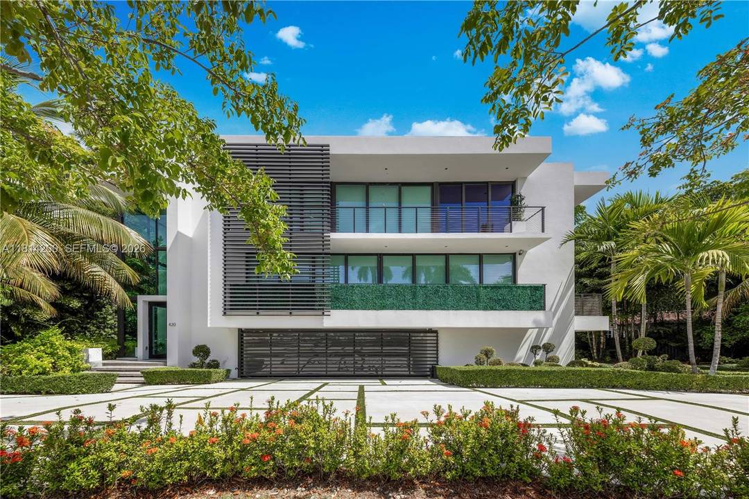 A modern masterpiece by award winning architect Ralph Choeff, located on the coveted, guard gated Hibiscus Island.