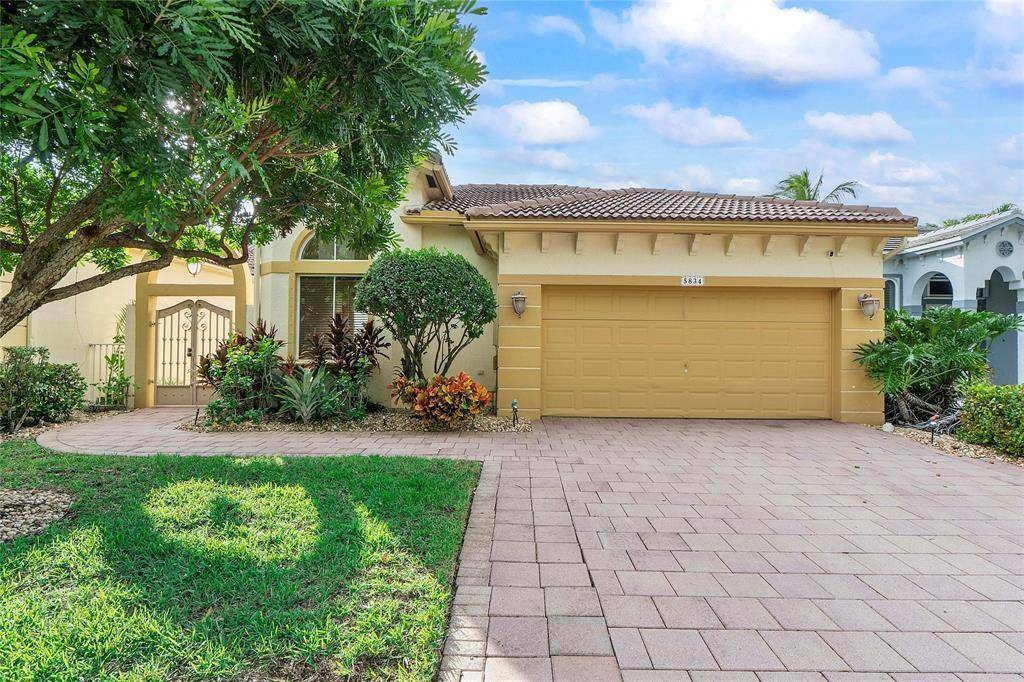 BEAUTIFUL IMMACULATE ONE STORY MEDITERRANEAN STYLE HOME IN THE GUARD GATED COMMUNITY OF HERON BAY !