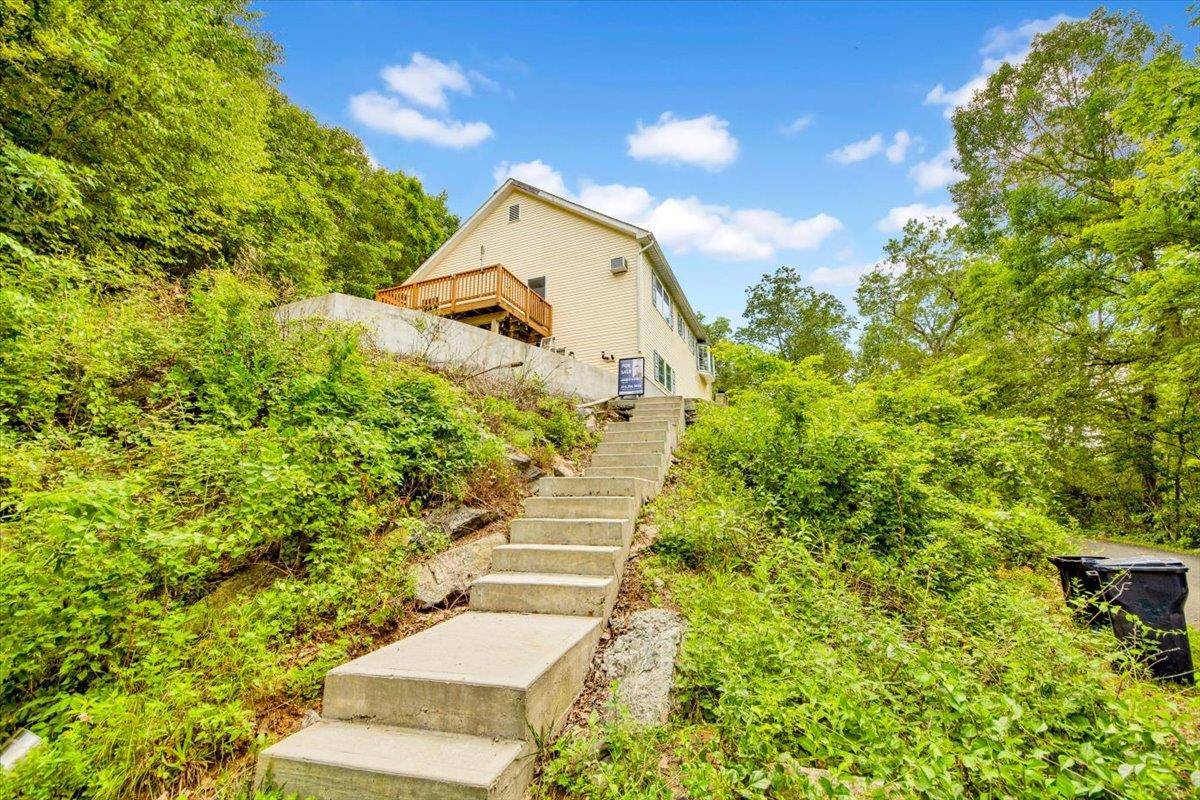 Perched on a hillside with water views, this beautifully renovated 3 bedroom, 3 bathroom raised ranch offers the perfect blend of privacy, space, and convenience.