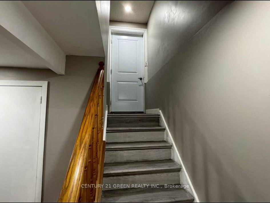 Spacious One Bedroom Basement Apartment featuring a private entrance, separate living area, and a full kitchen.