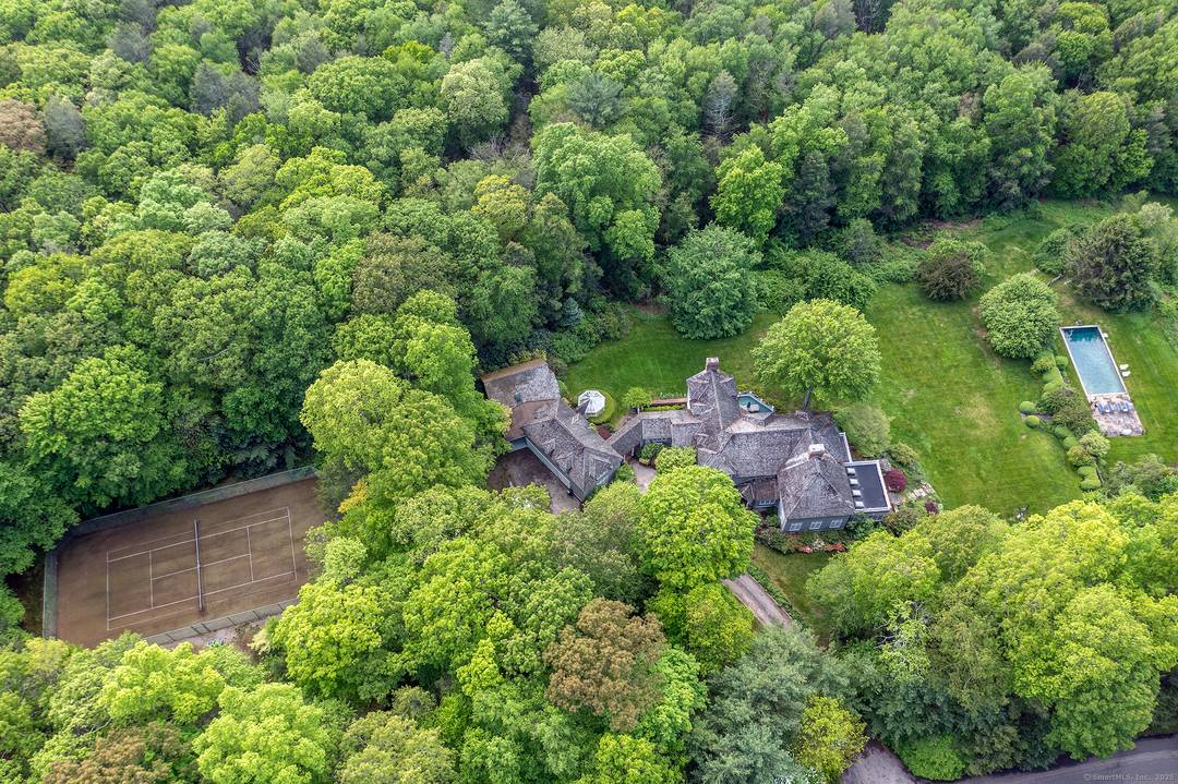 A private gated road leads to this elegant shingle style estate on 20 secluded acres in the beautiful Litchfield Hills with spectacular views that go on for miles.