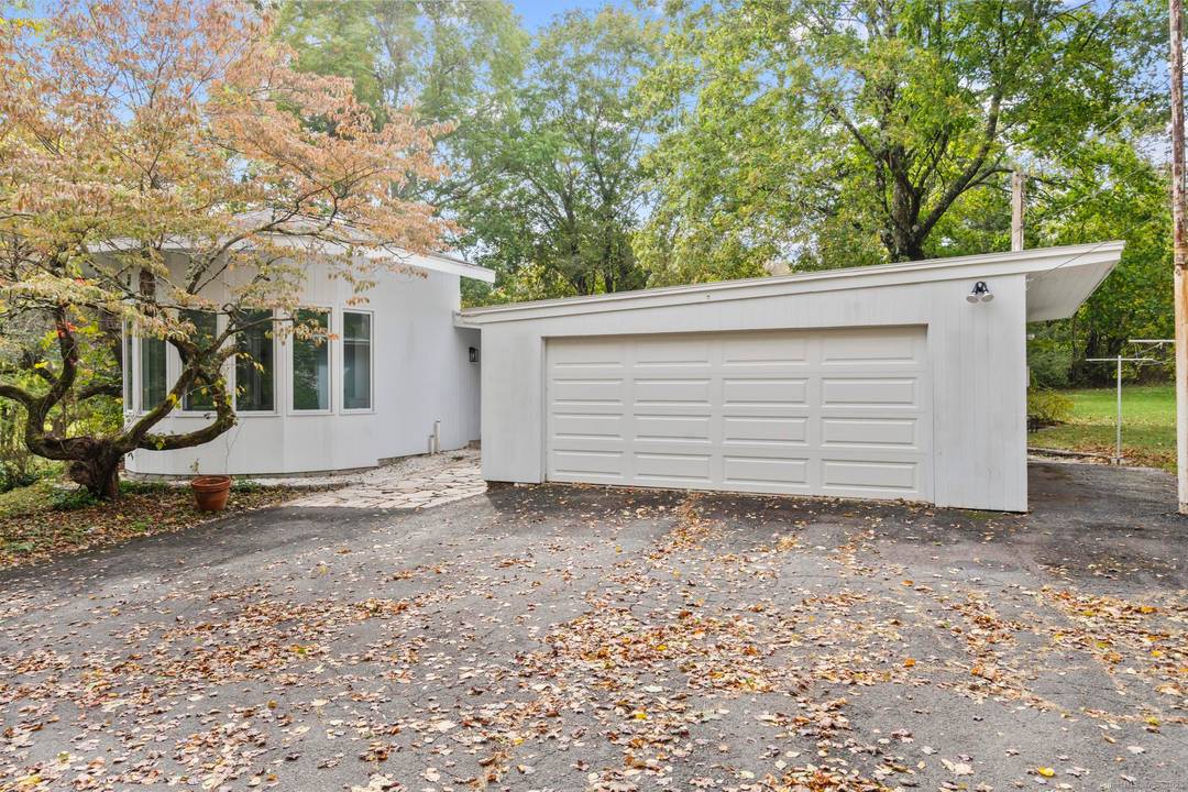 Step into this one of a kind mid century ranch, nestled in the heart of Monroe.