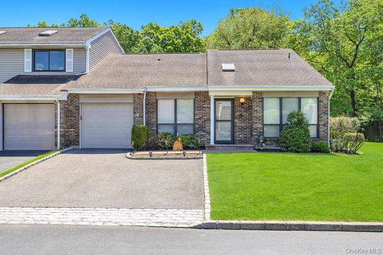 Welcome to 73 South Pond Lane, a beautifully maintained townhouse nestled within the highly desirable Hidden Ponds community in Smithtown.
