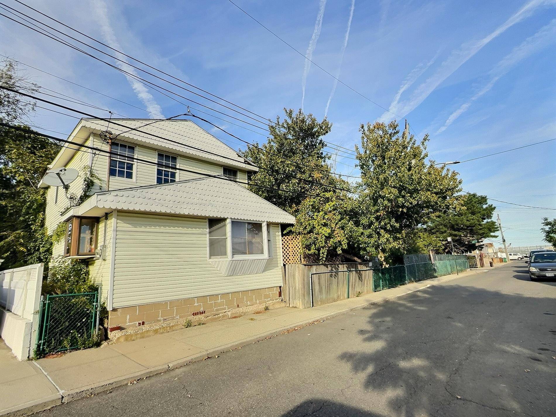 Exceptional value and tremendous upside on this corner, large, versatile property featuring two separate homes.