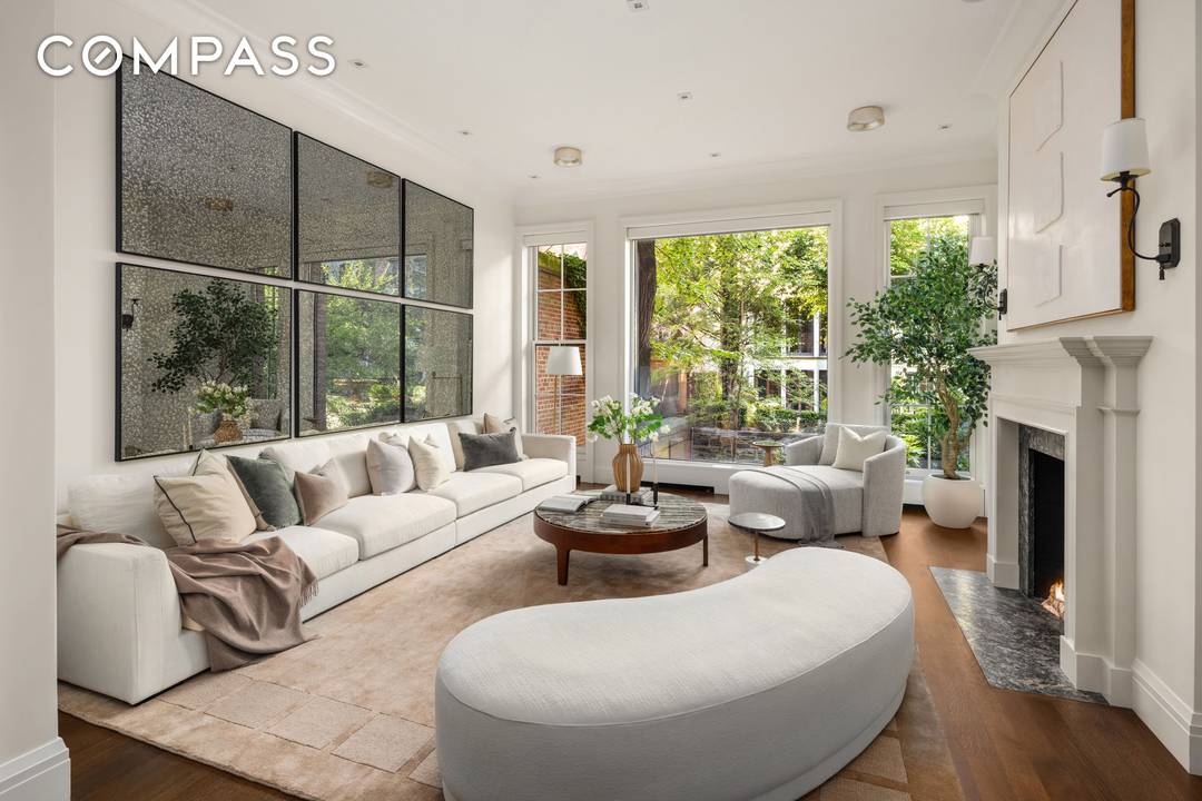 Fully renovated and turnkey, this immaculate 19th century brownstone sits on one of Manhattan's very few privately shared gardens.