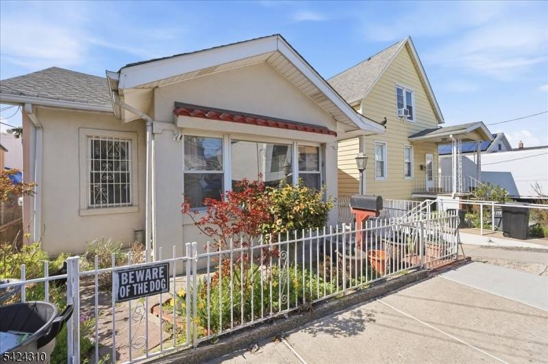 Welcome to this charming Colonial style single family home in North Bergen's highly desirable Racetrack Section.