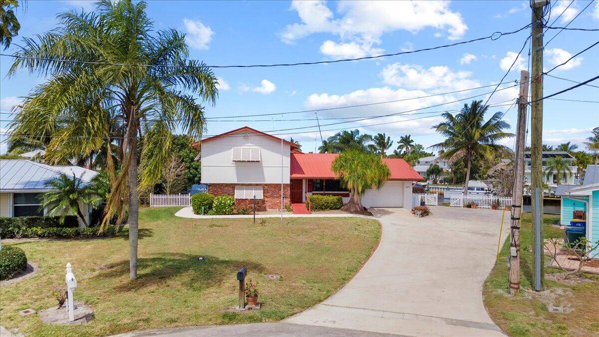 Prime Waterfront Corner Lot with Endless Potential in Seagate Harbor Unlock the full potential of one of Palm City's most coveted waterfront parcels, nestled in the highly sought after boating ...