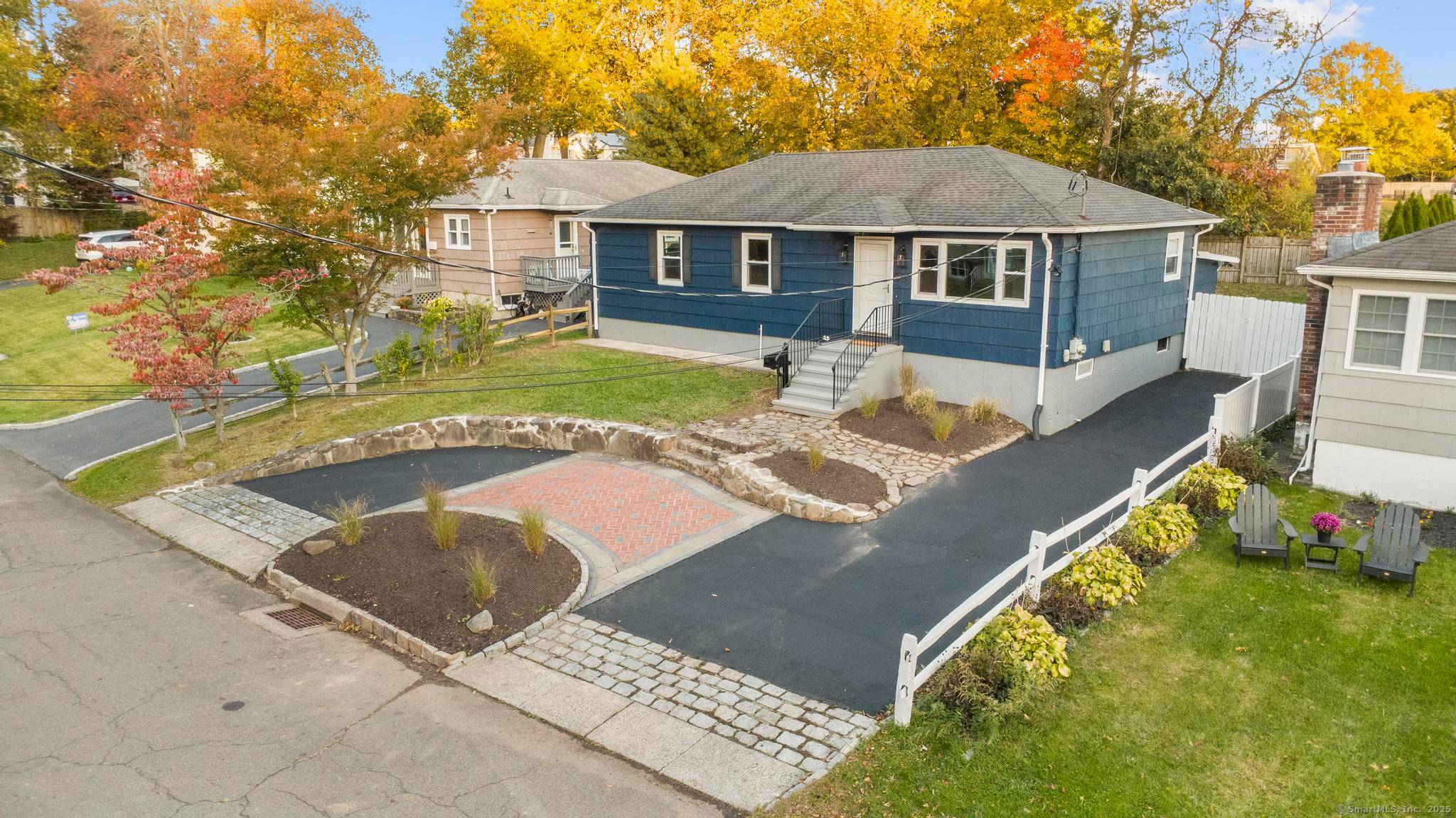 Pull into your charming half circle driveway and instantly fall in love with this home's incredible curb appeal.