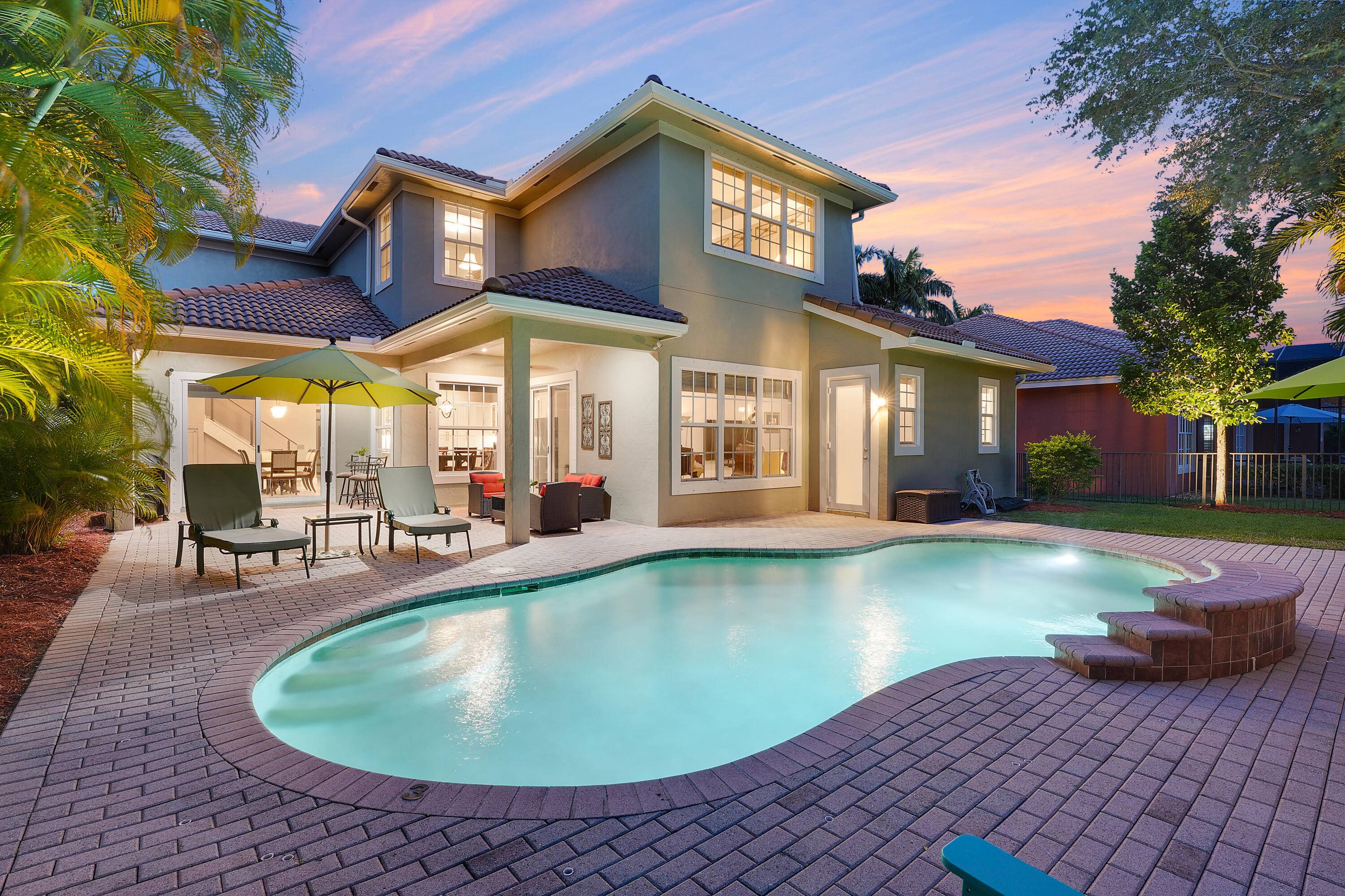 Tucked away in the heart of Jupiter, this extraordinary lakefront retreat offers approx.