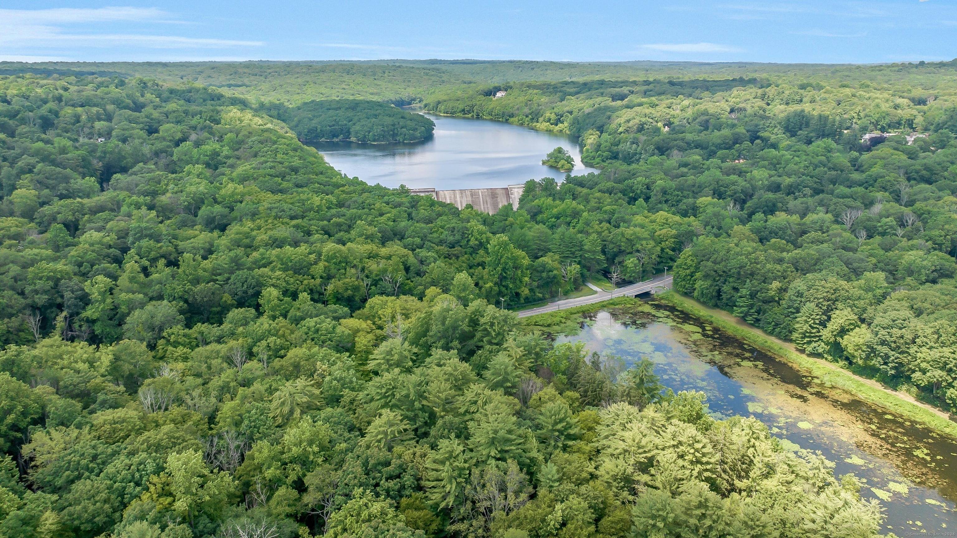 Lifetime opportunity to create your own private dream estate on 13 magnificent waterfront acres with gorgeous views.