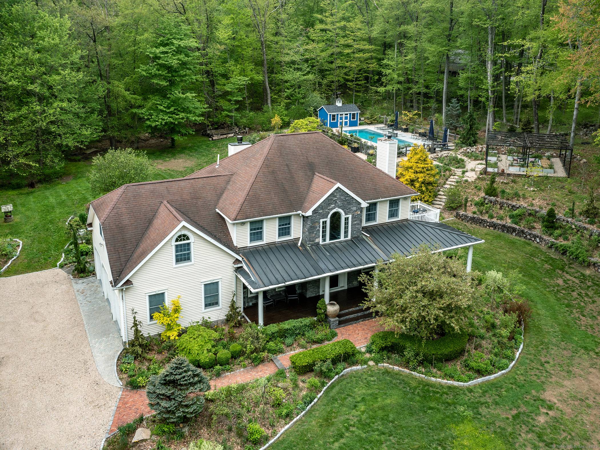 Fantastic Colonial in Roxbury down long private drive featuring low maintenance salt water spa pooL.