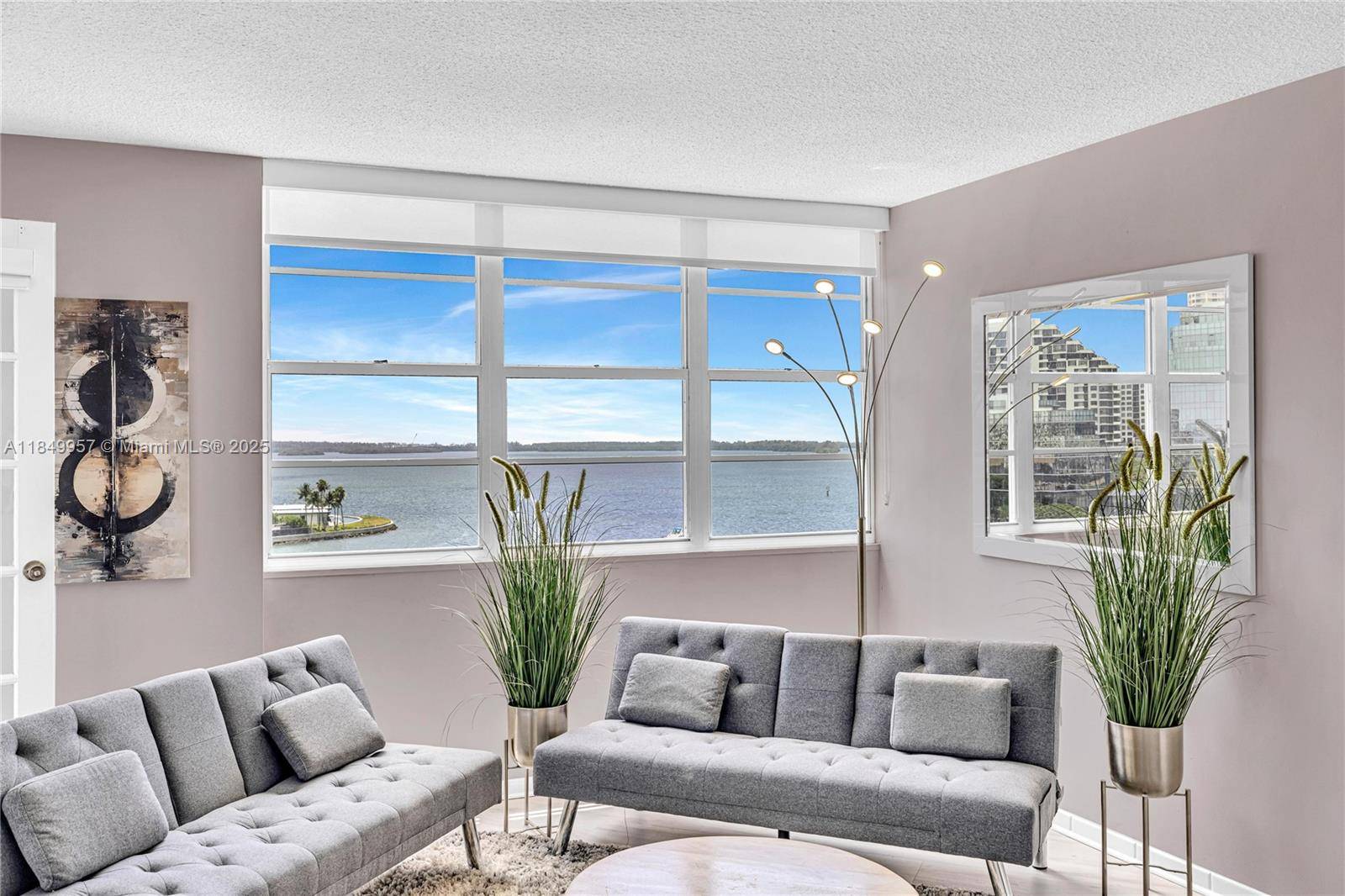Perched above Biscayne Bay, Residence 970 at Four Ambassadors offers a front row seat to Miamis most cinematic views from sunrise over the water to the shimmering lights of Brickell ...
