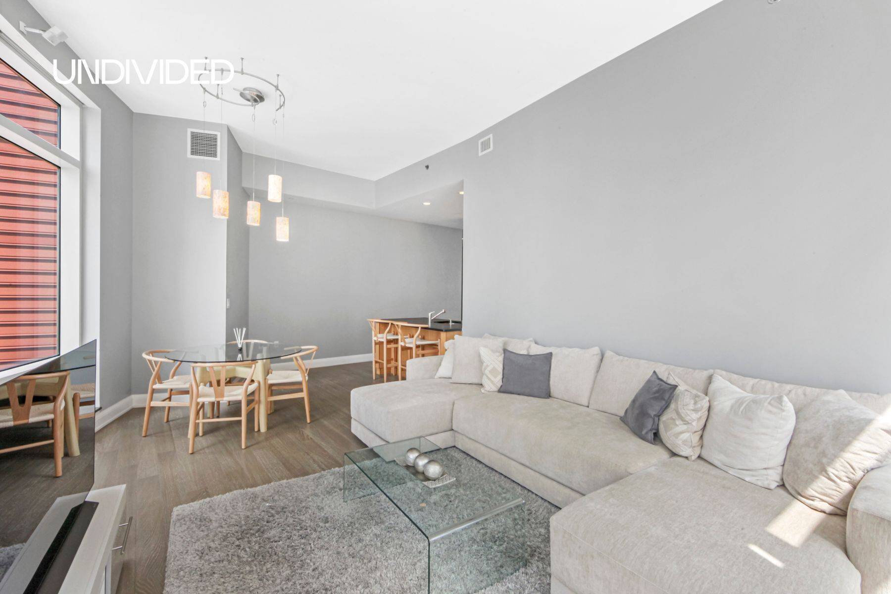 Wrapped floor to ceiling with expansive windows, this corner unit at The Visionaire is filled with light from sunup to sundown.