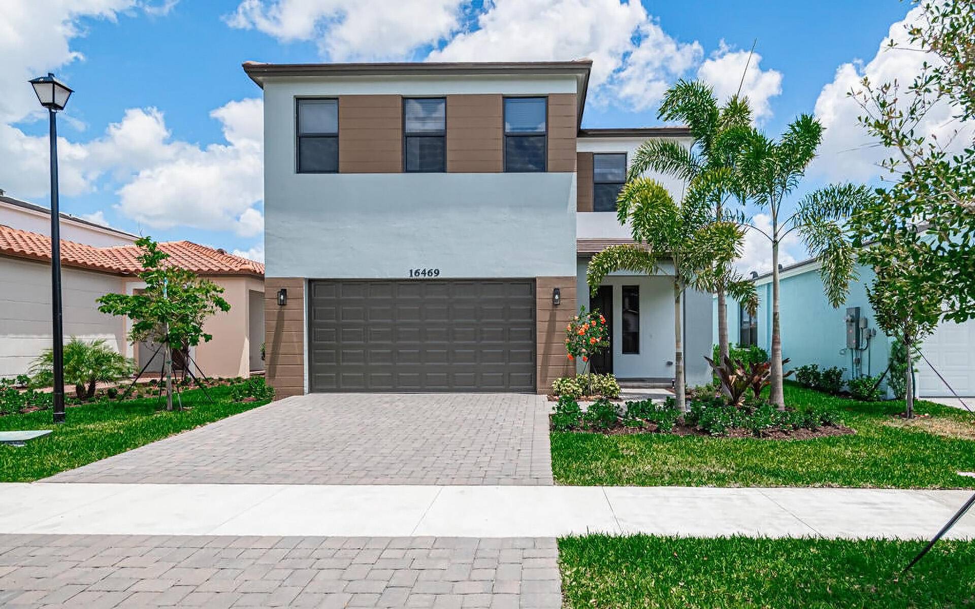 Welcome to 16469 Sea Turtle Place, the newest waterfront smart home built in 2024 in gated community Sky Cove.