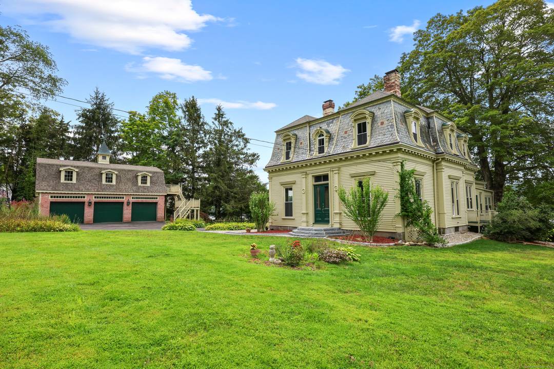 The striking David Watrous house, located on the CT river, offers unobstructed views of the river where it merges with the Salmon river from every room.
