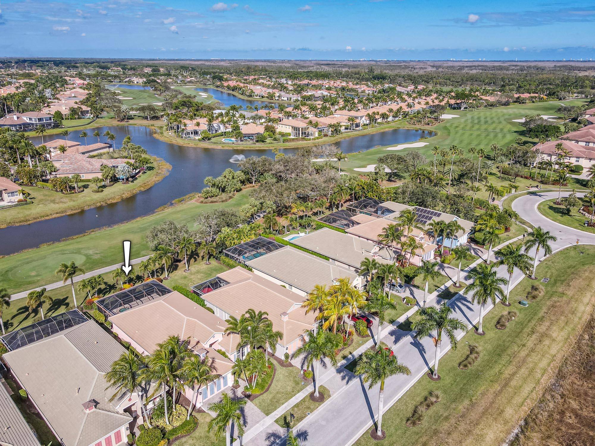 Great Preserve home with open floor plan and pool over golf course.