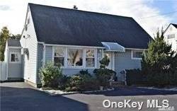 This Cape Has Been Fully Renovated With 4 Bedrooms and 2 Full Bathrooms.