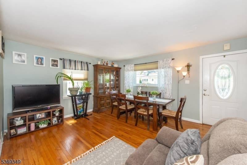 Welcome to this beautifully maintained Cape Cod style home that perfectly blends classic charm with modern comfort.