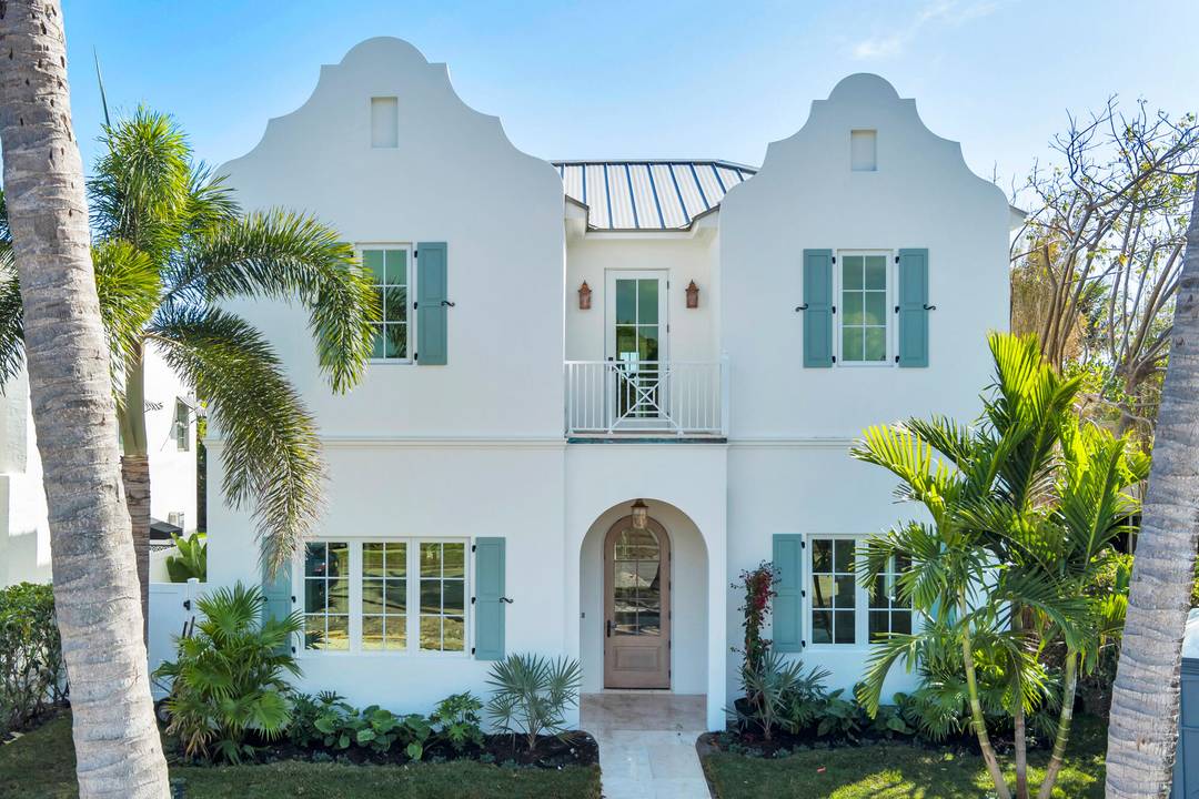 Situated south of Southern Boulevard and east of Olive Avenue, this sophisticated new construction residence showcases classic architecture and timeless elegance.