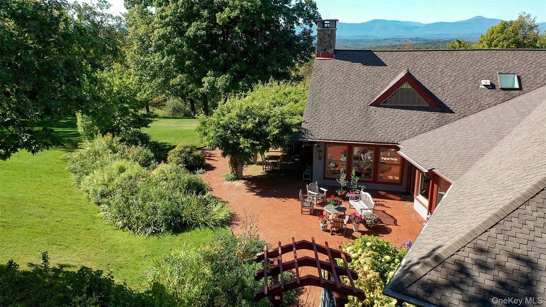 Nearly 30 secluded acres of rolling meadows and woodlands unfold into breathtaking panoramic views of the Catskill Mountains.