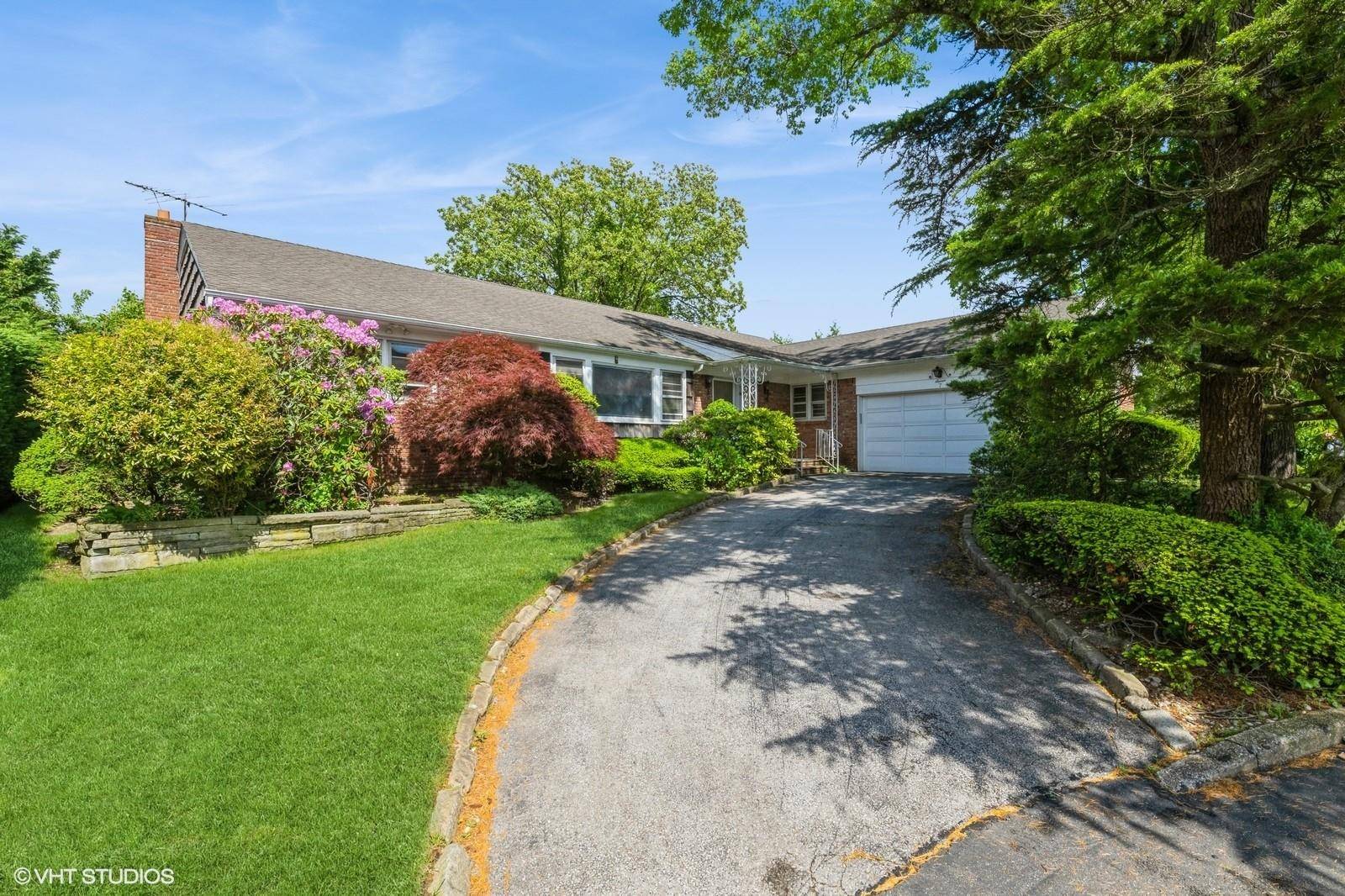 Nestled on a quiet Lawrence cul de sac this oversized ranch delivers privacy without sacrificing walk to everything convenience.