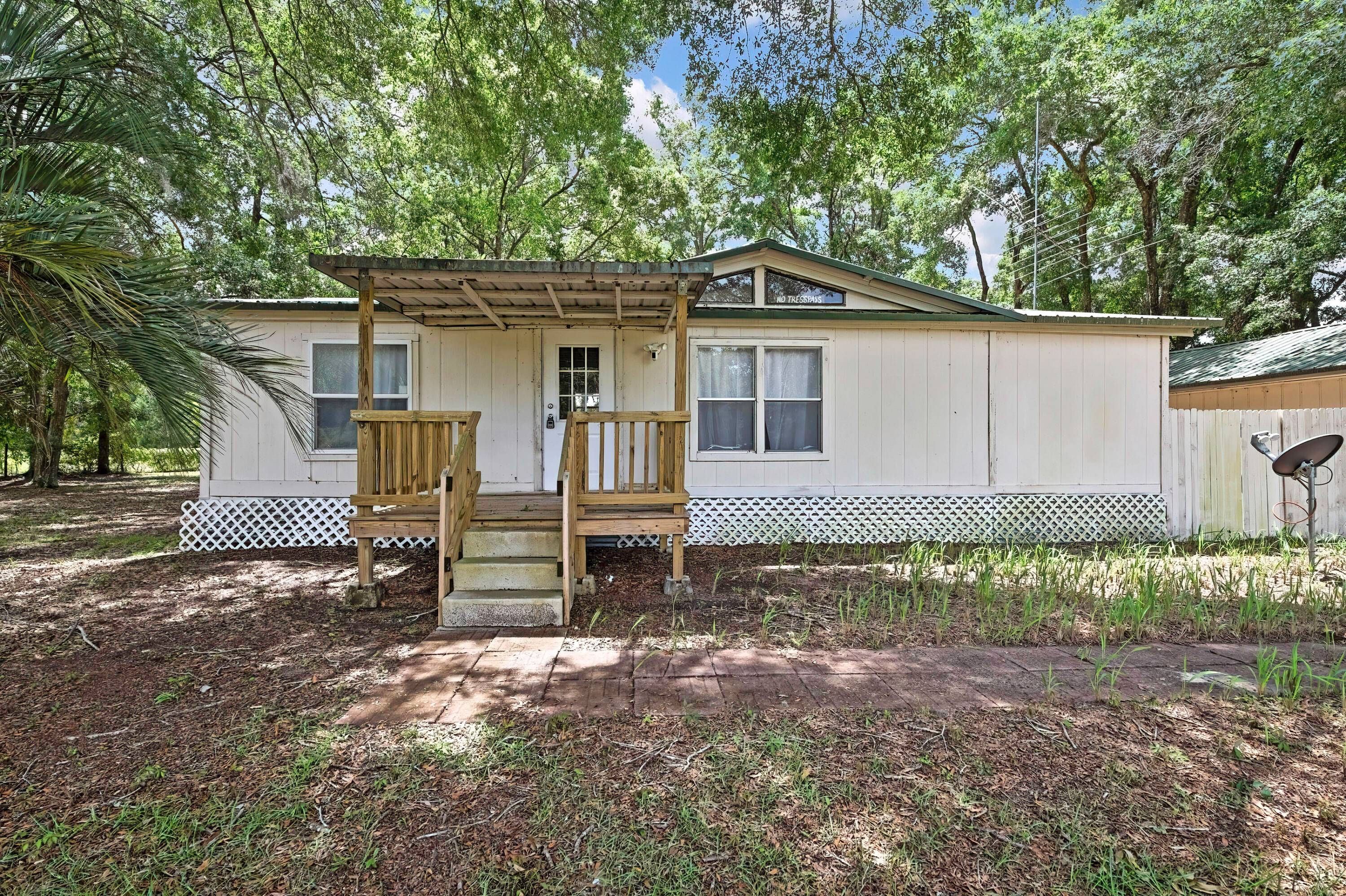 Escape to your very own private sanctuary nestled in the heart of Brooksville, FL, where modern luxury meets tranquil countryside charm on 1.