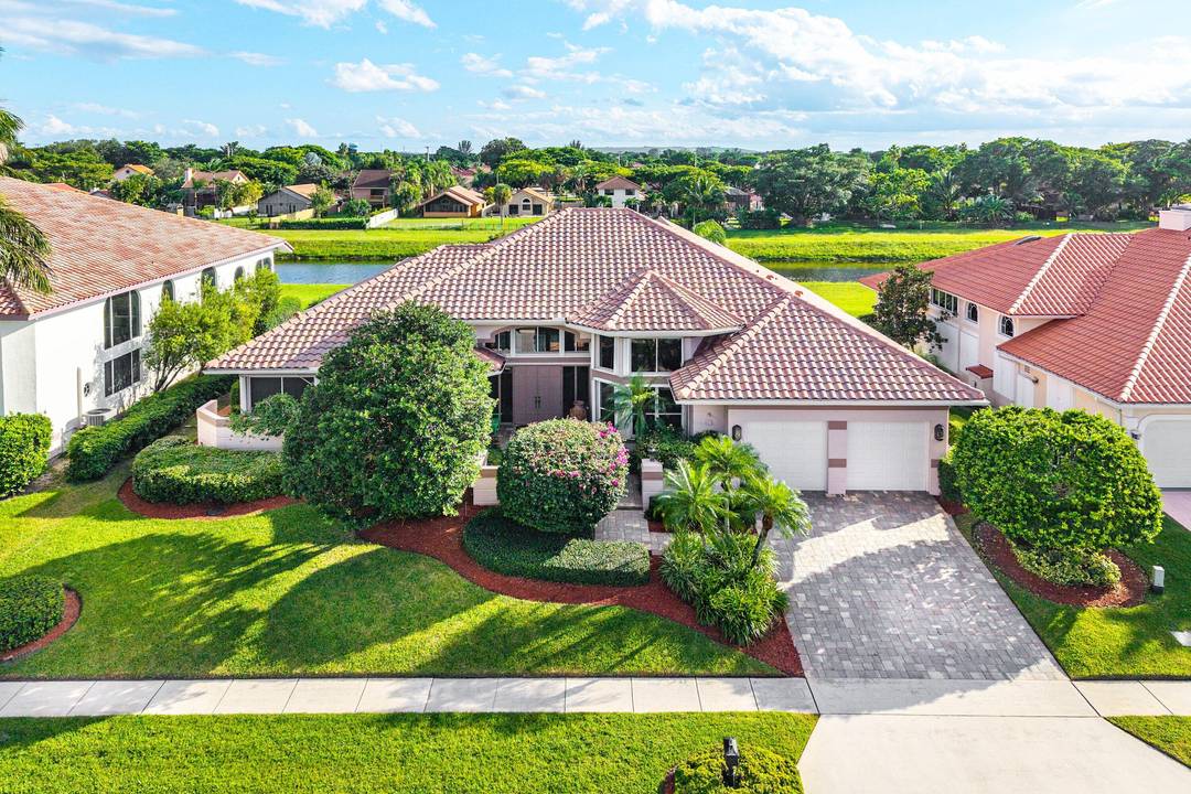 Welcome to the epitome of elegance in the private enclave of Encantada at Boca Pointe.