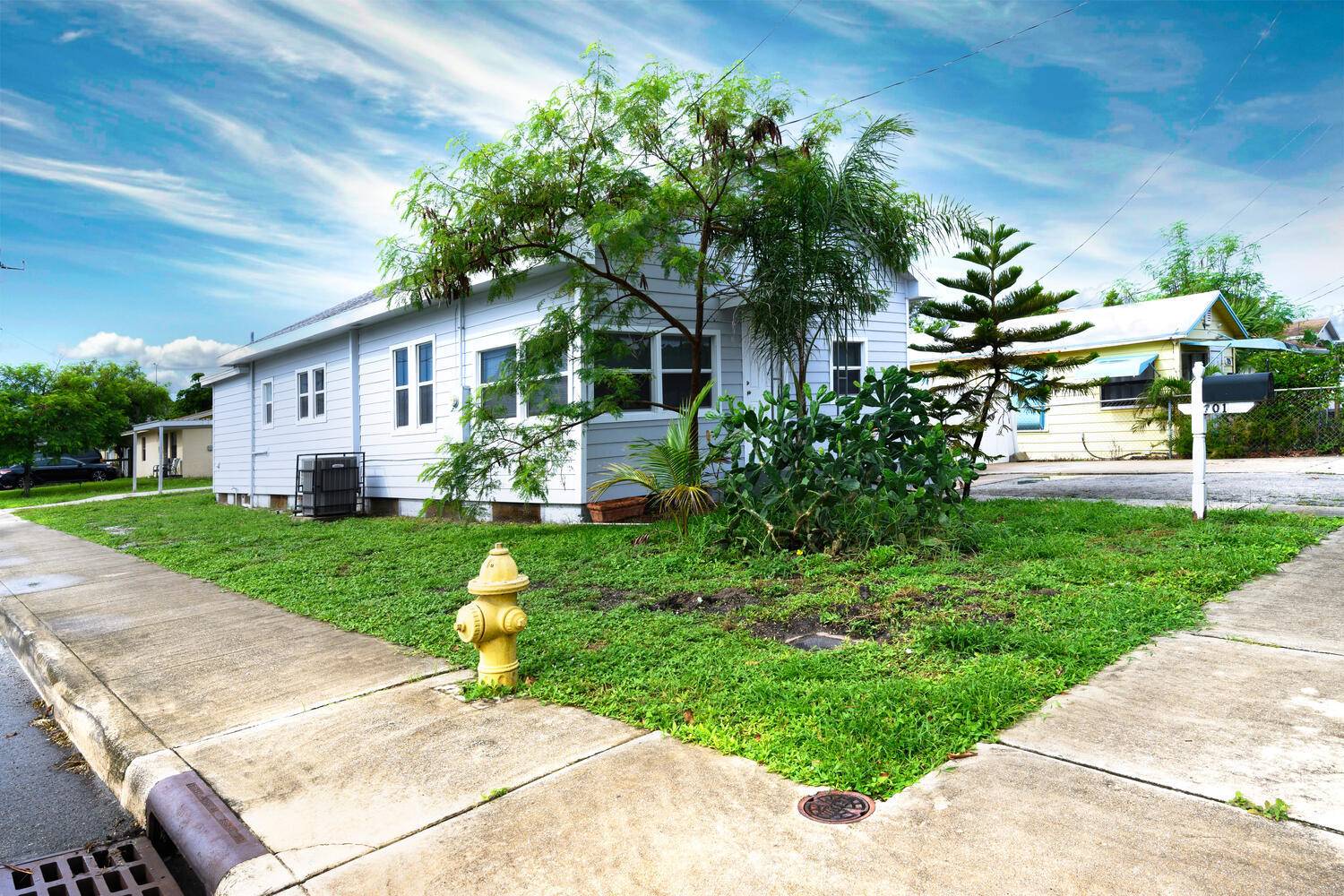 Discover this beautifully updated 4 bedroom, 2 bath Key West style home nestled on a generous 50' x 135' corner lot in the desirable Whispering Palms neighborhood.