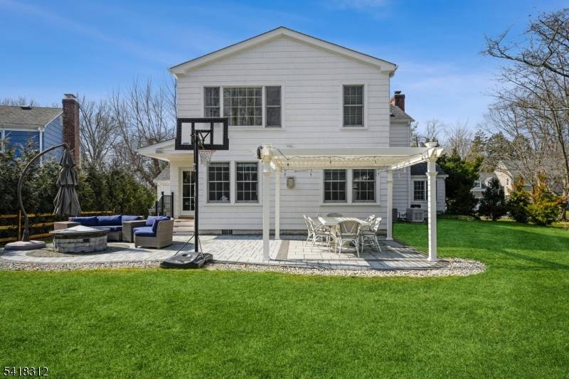 Experience sophisticated suburban living in this impeccably renovated colonial, set on nearly a half acre of lush, level grounds in one of Summit's most coveted neighborhoods.