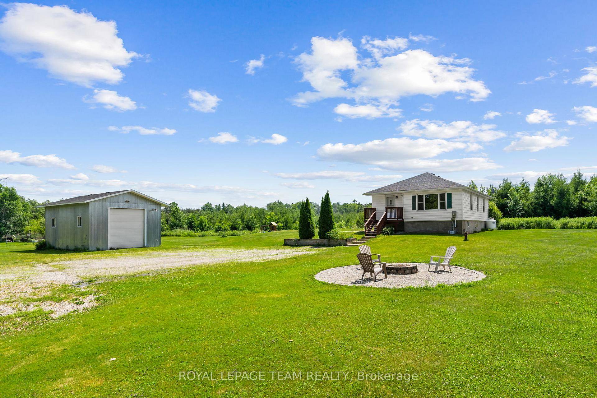 Welcome to this freshly renovated bungalow nestled at the end of a peaceful dead end road, set on a private and picturesque one acre lot.