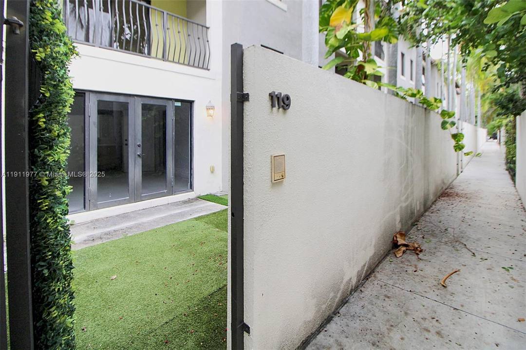 Tri level townhome in gated Grove Villas, set amidst Coconut Grove s lush vegetation.