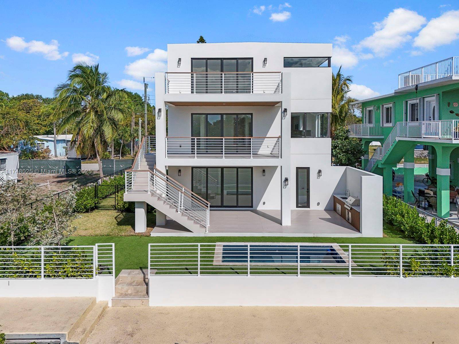 This brand new tri level home in the FL Keys perfectly captures the essence of sophisticated luxury amp ; relaxed island living.