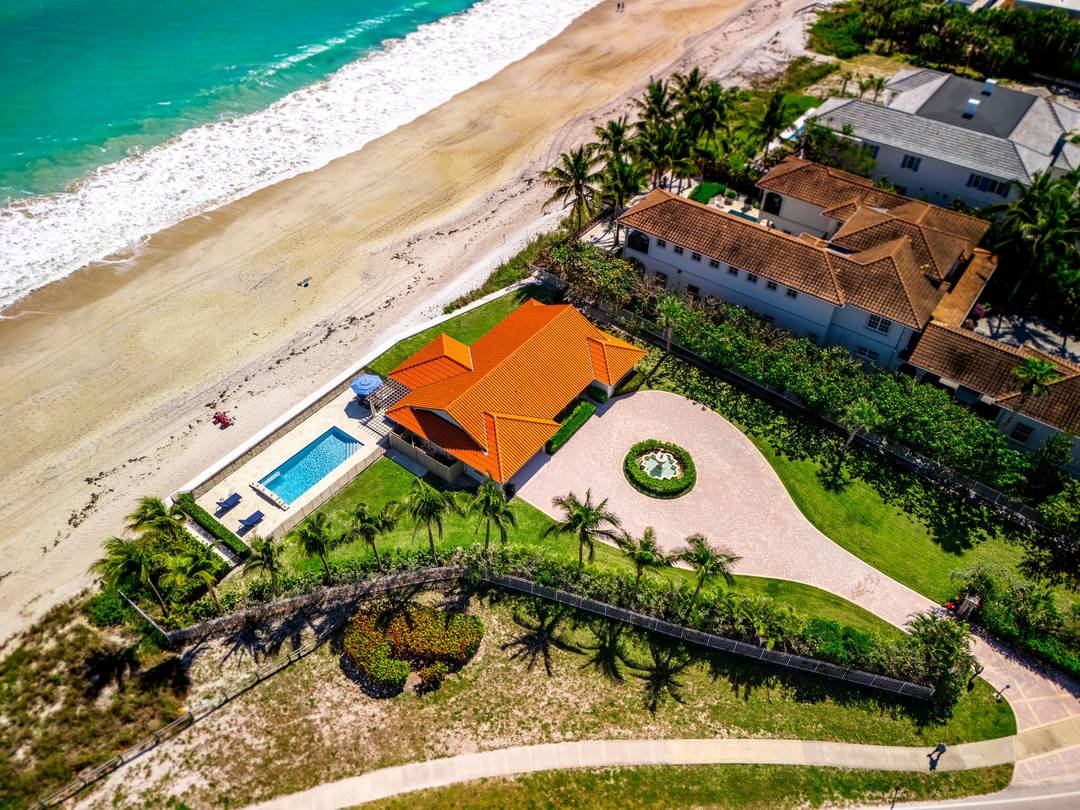 Oceanfront charm meets modern coastal living in this stunning remodeled 3 bedroom, 3 bath home in sought after Central Beach with 261 feet of direct ocean frontage.