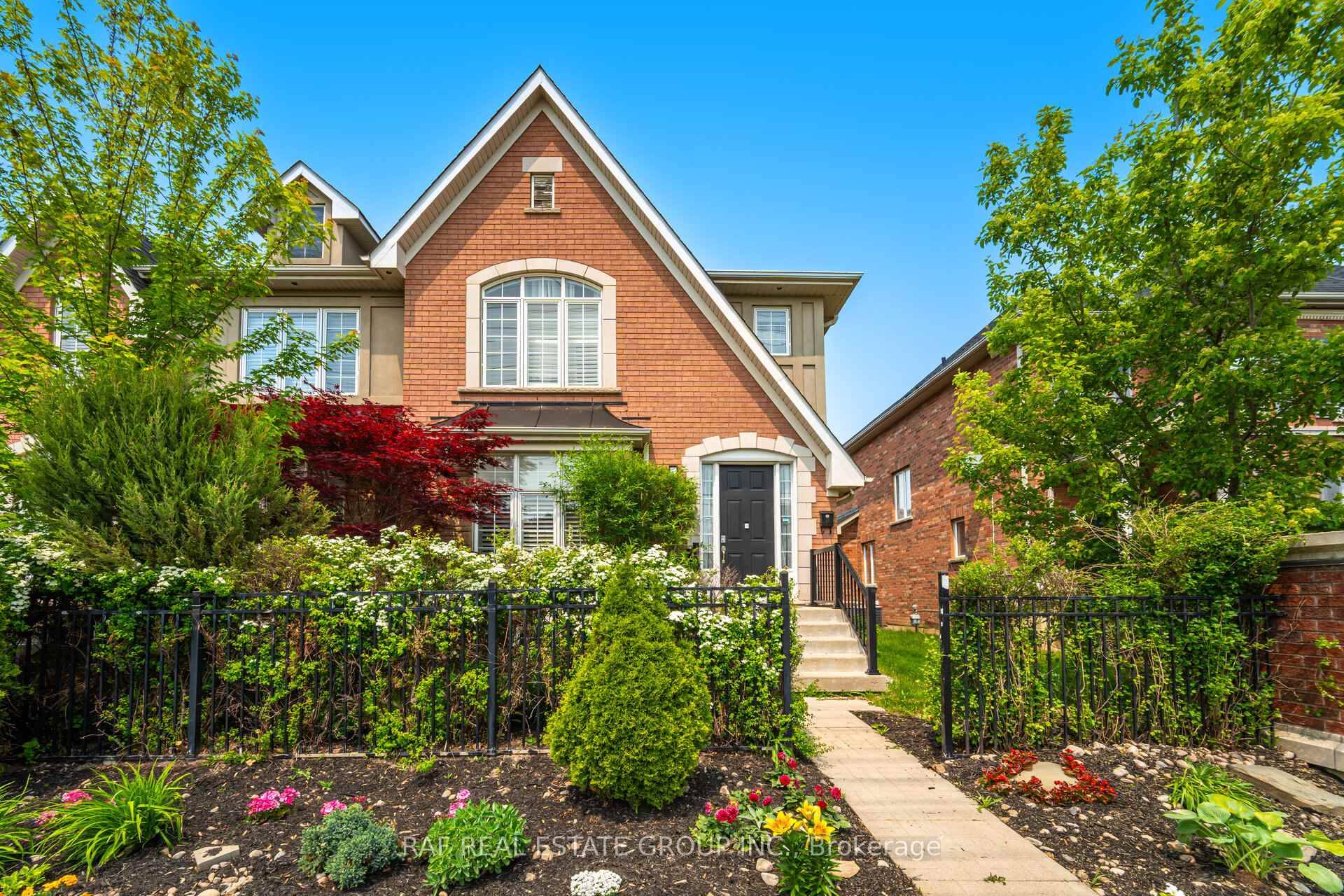 Stunning Cachet Built Executive Freehold End Unit Townhome with a rare Double Car Garage and a spectacular landscaped backyard, located in the prestigious Churchill Meadows community !
