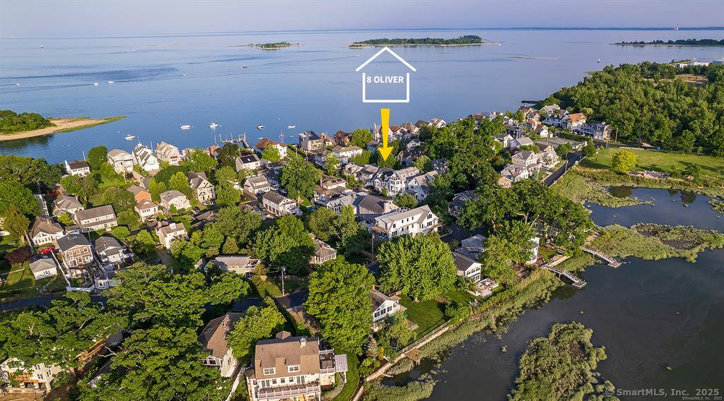 Coastal Retreat in the coveted Harborview community and steps to Long Island Sound.