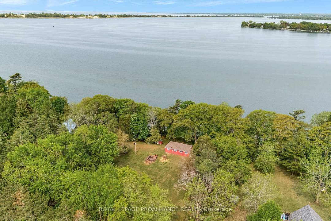 This spectacular 1. 22 acre property with cottage has 160 feet of beautiful waterfront, overlooking West Lake and the Sandbanks Provincial Park.